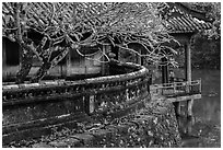 Luu Khiem Lake edge with stone fence and pavilion, Tu Duc Tomb. Hue, Vietnam ( black and white)