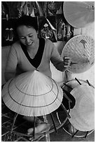 Woman crafting conical hat. Hue, Vietnam ( black and white)