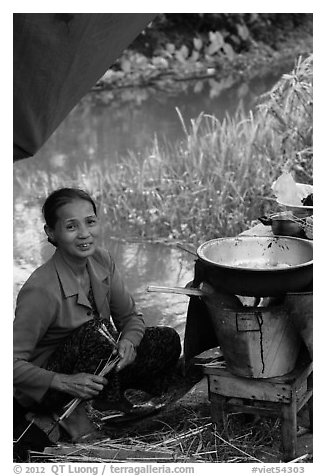 Woman cooking canalside, Thanh Toan. Hue, Vietnam (black and white)