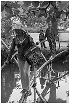 Women crossing monkey bridge, Thanh Toan. Hue, Vietnam (black and white)