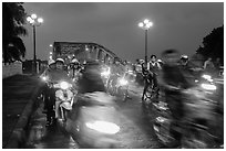 Night motorcyle traffic out of Trang Tien bridge. Hue, Vietnam ( black and white)