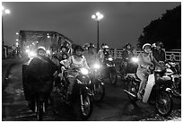 Mtorcylists by night, Trang Tien Bridge. Hue, Vietnam (black and white)
