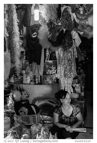Store selling party costumes and decorations, old quarter. Hanoi, Vietnam (black and white)