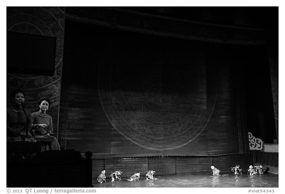 Musicians and water puppets during performance, Thang Long Theatre. Hanoi, Vietnam