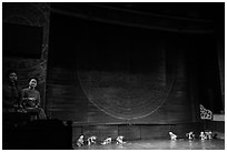 Musicians and water puppets during performance, Thang Long Theatre. Hanoi, Vietnam (black and white)