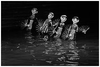 Water puppets (4 characters with fans), Thang Long Theatre. Hanoi, Vietnam ( black and white)