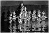 Water puppets (14 characters with lotus), Thang Long Theatre. Hanoi, Vietnam ( black and white)
