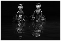 Water puppets (2 characters with fans), Thang Long Theatre. Hanoi, Vietnam ( black and white)