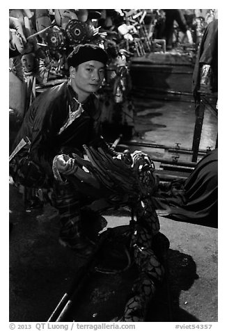 Water puppet artist holding dragon backstage, Thang Long Theatre. Hanoi, Vietnam