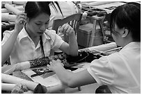 Women in silk embroidery factory. Vietnam ( black and white)