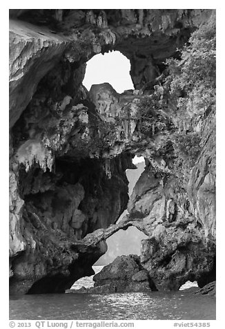 Openings through rocks. Halong Bay, Vietnam (black and white)