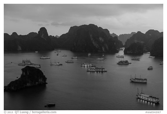 Moored boats and islands from above at dusk. Halong Bay, Vietnam