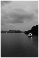 Tour boats lights at dawn. Halong Bay, Vietnam (black and white)
