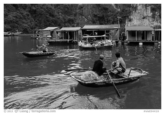 Villagers and houses, Vung Vieng fishing village. Halong Bay, Vietnam (black and white)