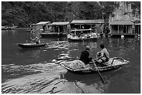 Villagers and houses, Vung Vieng fishing village. Halong Bay, Vietnam (black and white)