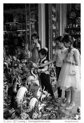 Children checkout ceramic store. Bat Trang, Vietnam