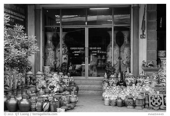 Ceramic store front with vases of all sizes. Bat Trang, Vietnam (black and white)