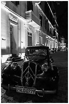 Vintage car in front of Metropole hotel at night. Hanoi, Vietnam ( black and white)