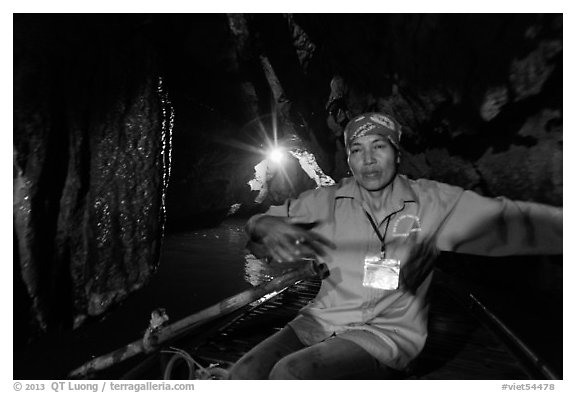 Woman boater in narrow cave passage, Trang An. Ninh Binh,  Vietnam (black and white)