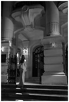 Woman in evening gown entering opera house. Hanoi, Vietnam ( black and white)