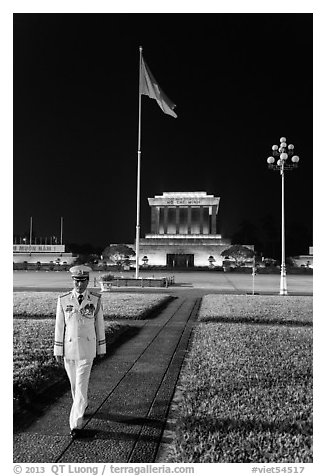 Officer walking in front of Ho Chi Minh Mausoleum. Hanoi, Vietnam (black and white)