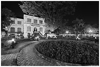 Public garden and French-area building at night. Hanoi, Vietnam (black and white)