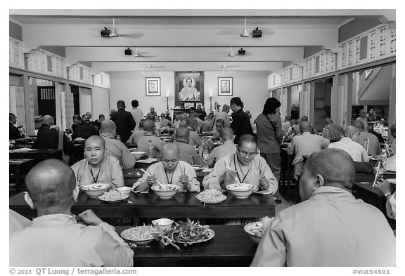 Monks and nuns having diner, An Quang Pagoda, district 10. Ho Chi Minh City, Vietnam (black and white)