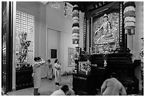 Women worshipping, An Quang Pagoda, district 10. Ho Chi Minh City, Vietnam ( black and white)