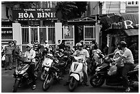 Parents waiting to pick up children in front of school. Ho Chi Minh City, Vietnam (black and white)