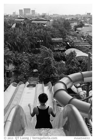 Woman on tall water slide, Dam Sen Water Park, district 11. Ho Chi Minh City, Vietnam (black and white)