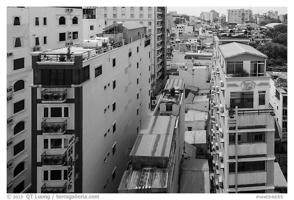 Rooftop view of skinny hotel buildings. Ho Chi Minh City, Vietnam (black and white)