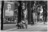 Family chatting with vendor in park. Ho Chi Minh City, Vietnam ( black and white)