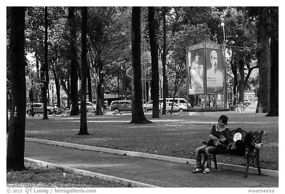 Relaxing on a public bench in April 30 Park. Ho Chi Minh City, Vietnam (black and white)