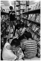 Children reading in bookstore. Ho Chi Minh City, Vietnam ( black and white)