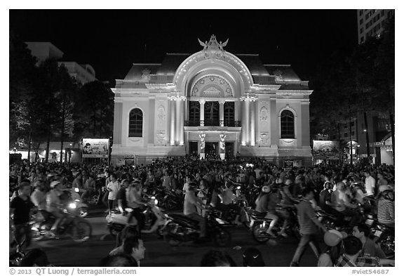 Crowds in front of Opera House at night. Ho Chi Minh City, Vietnam (black and white)