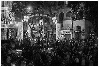Crowds on street at night, New Year eve. Ho Chi Minh City, Vietnam (black and white)