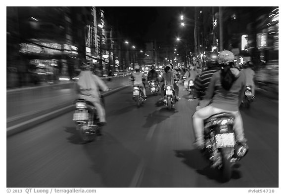 Riders view of motorcycle traffic at night. Ho Chi Minh City, Vietnam