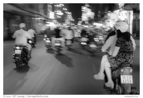 Riders view of motorcycle traffic blurred by speed. Ho Chi Minh City, Vietnam (black and white)