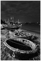 Coracle boats at night. Mui Ne, Vietnam (black and white)