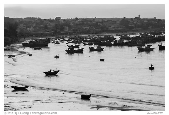 Fishing fleet and village at dawn. Mui Ne, Vietnam