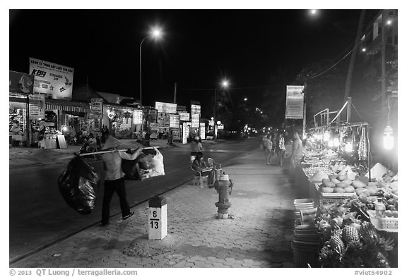 Stalls on main street at night. Mui Ne, Vietnam (black and white)