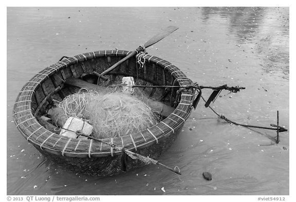 Round coracle boat with fishing gear. Mui Ne, Vietnam (black and white)