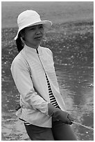 Fisherwoman pulling net line. Mui Ne, Vietnam ( black and white)