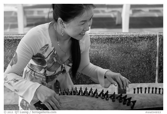 Musician with instrument. My Tho, Vietnam (black and white)