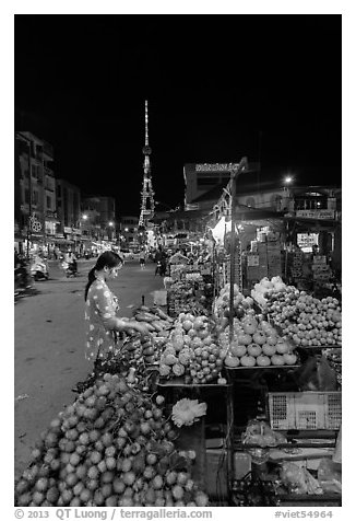 Fruit vendor on main street at night. Tra Vinh, Vietnam (black and white)