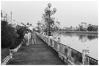 Elderly women strolling on riverfront. Tra Vinh, Vietnam ( black and white)