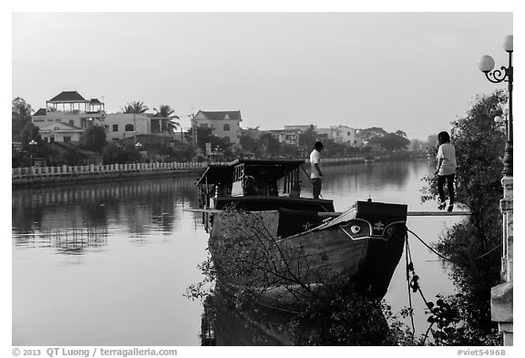 Couple on barge, Long Binh River. Tra Vinh, Vietnam