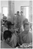 Theravada monks in dining room, Hang Pagoda. Tra Vinh, Vietnam (black and white)