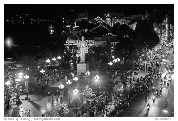 Mekong River, Ho Chi Minh statue, and street at night. Can Tho, Vietnam (black and white)