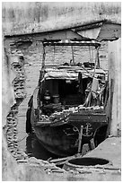Boat loaded with bricks seen from brick wall opening. Can Tho, Vietnam ( black and white)